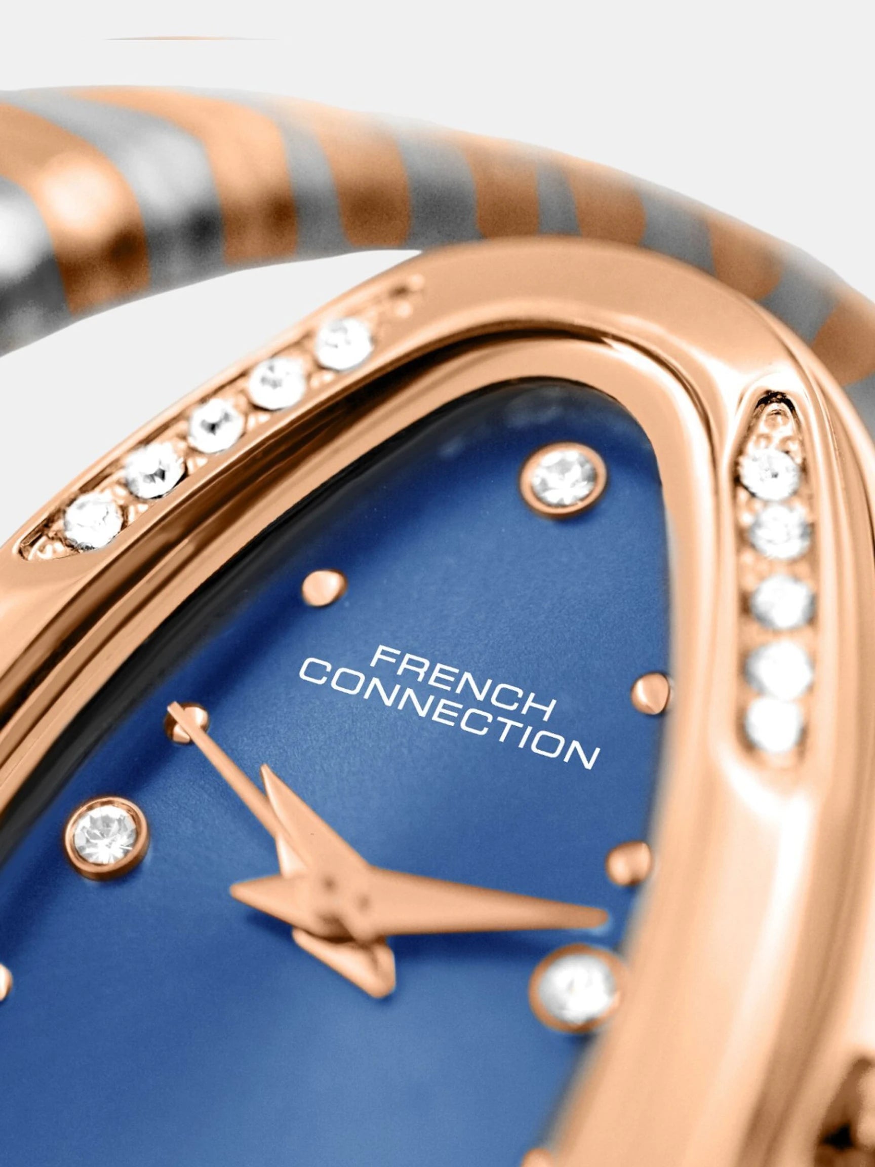 French Connection The Mystic Curve Women's Rose Gold Watch | Rhinestones Blue Sunray Dial Analog Watch – For Women FCN0110URTM