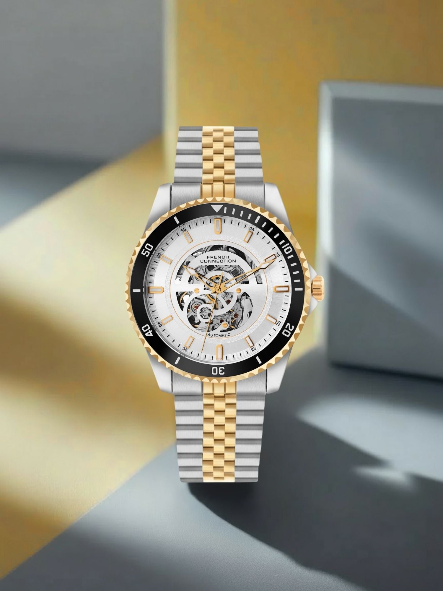 French Connection Aether Drive Men's Automatic Skeleton Watch with White Sunray Dial, Two-Tone Gold & Silver Stainless Steel Bracelet – FCA26STM