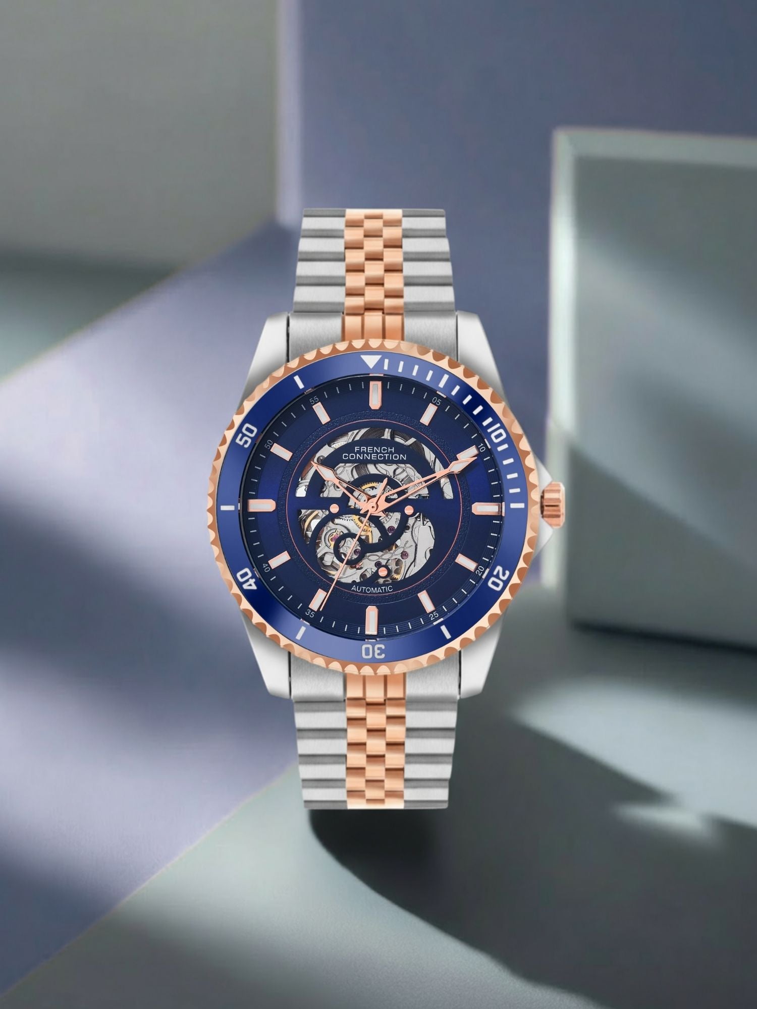 French Connection Aether Drive Men's Automatic Skeleton Watch with Blue Sunray Dial, Two-Tone Rose Gold & Silver Stainless Steel Bracelet – FCA26URTM