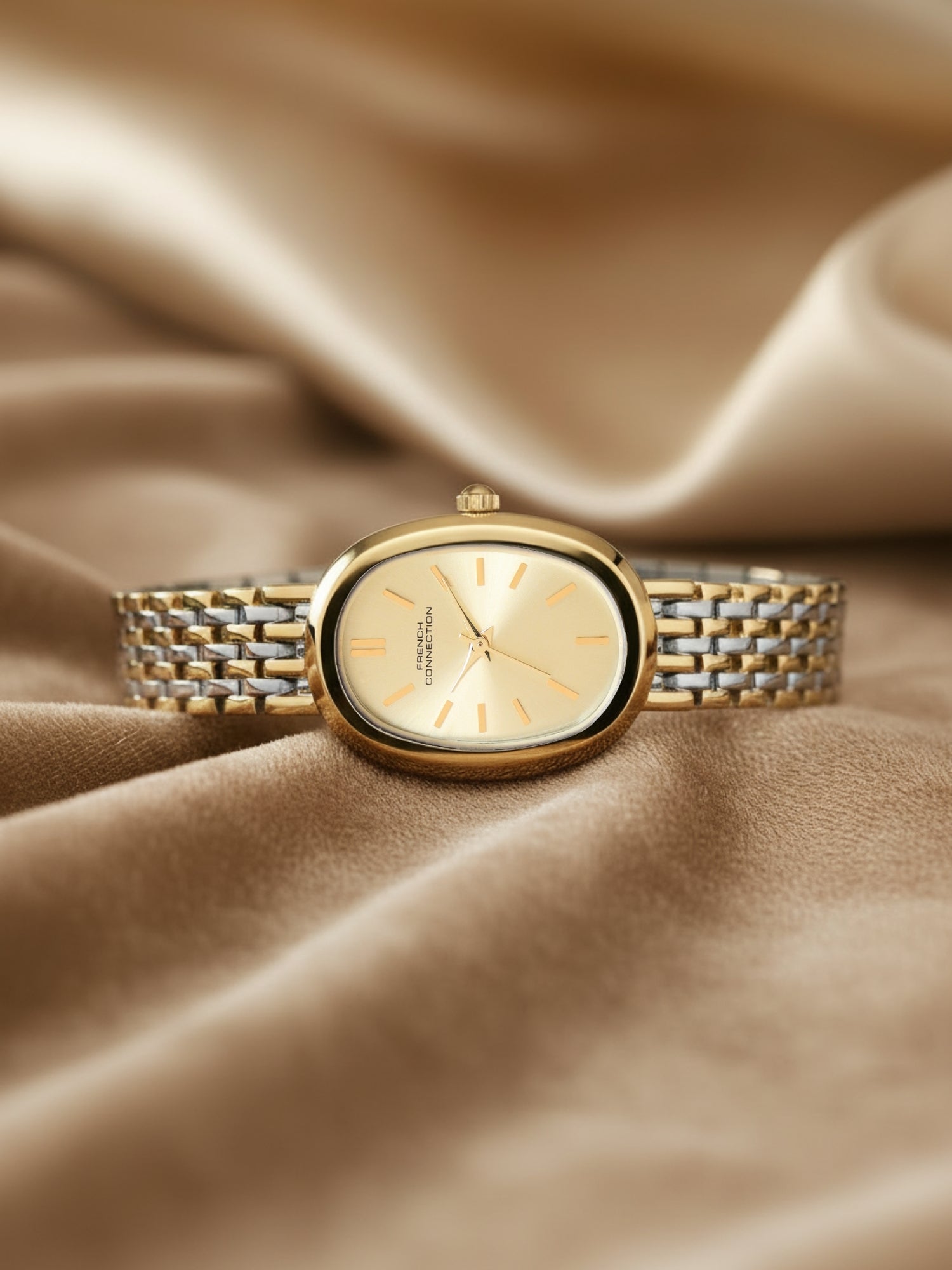 French Connection Sunray Champagne Oval Dial With Gold Two Tone Stainless Steel Strap Watch - For Womens FCN0130TM