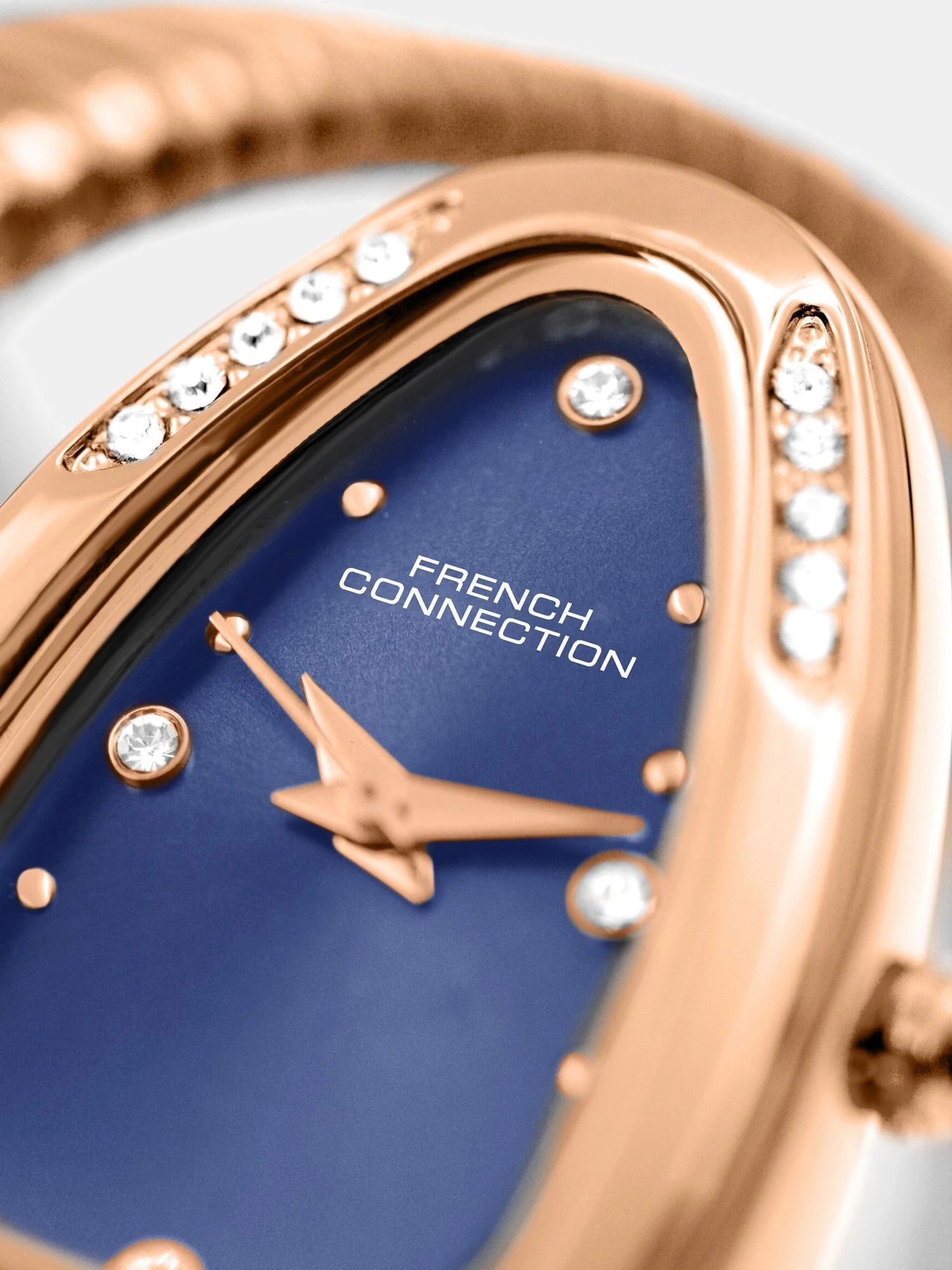 French Connection The Mystic Curve Women's Rose Gold Watch | Rhinestones Blue Sunray Dial Analog Watch – For Women FCN0110RGM