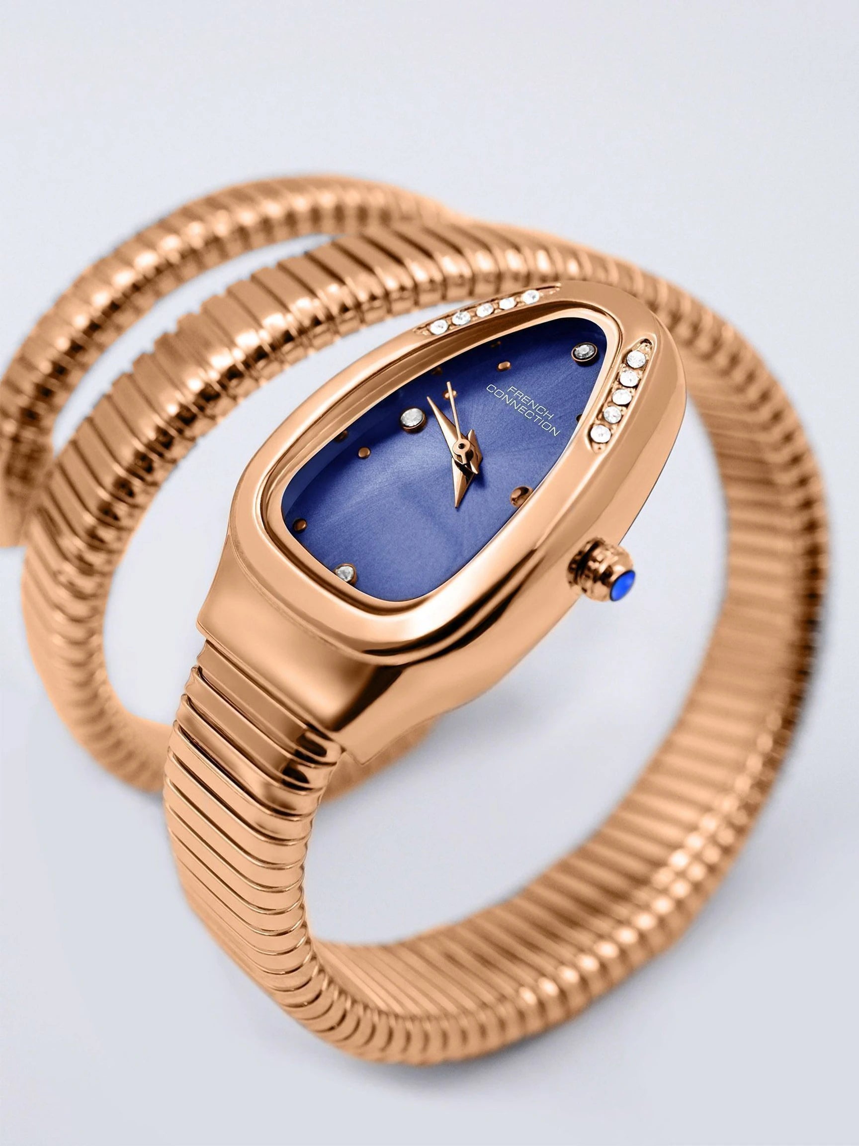 French Connection The Mystic Curve Women's Rose Gold Watch | Rhinestones Blue Sunray Dial Analog Watch – For Women FCN0110RGM