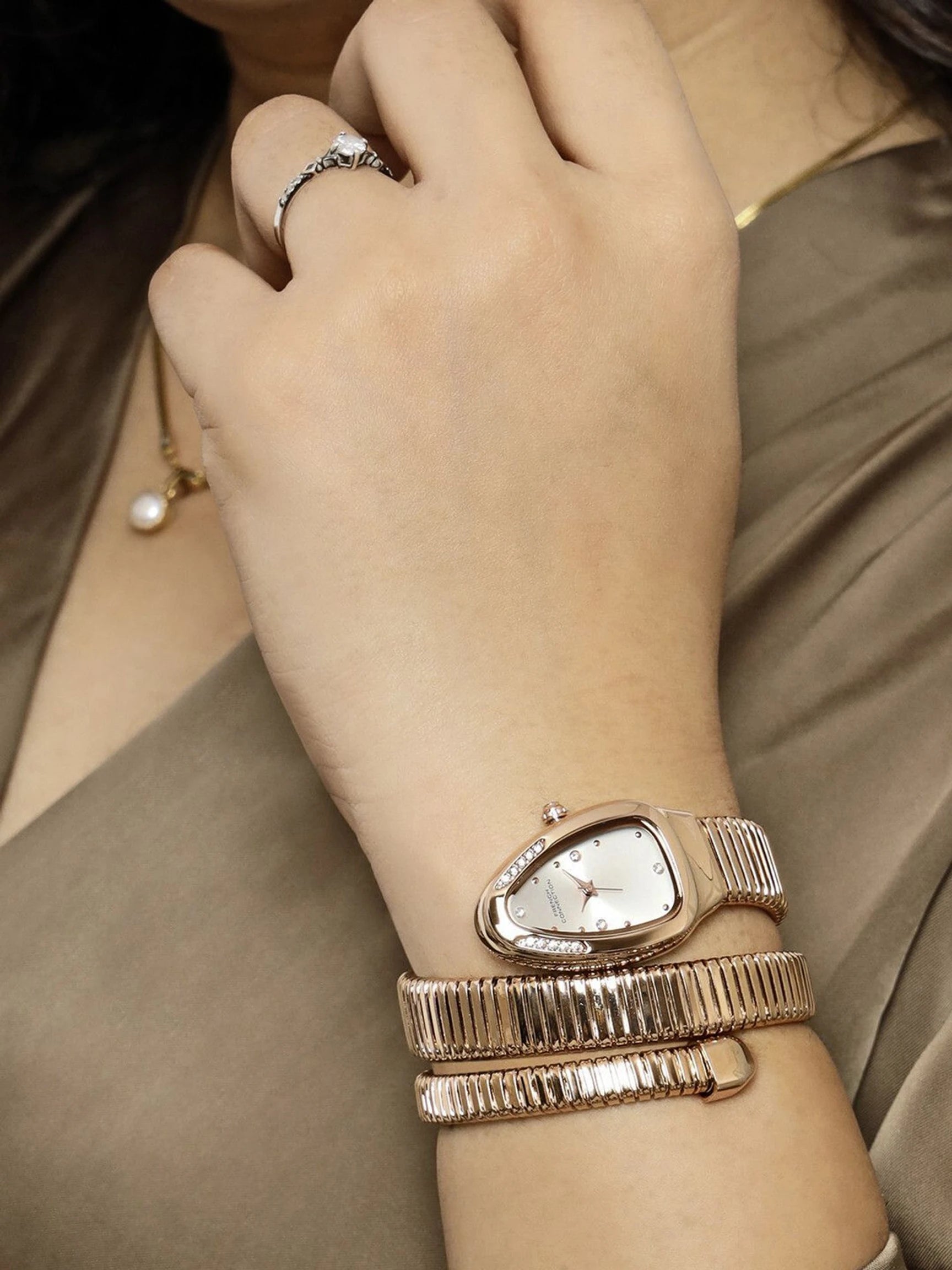 French Connection The Mystic Curve Women's Rose Gold Watch | Rhinestones Silver Sunray Dial Analog Watch – For Women FCN0110SRGM