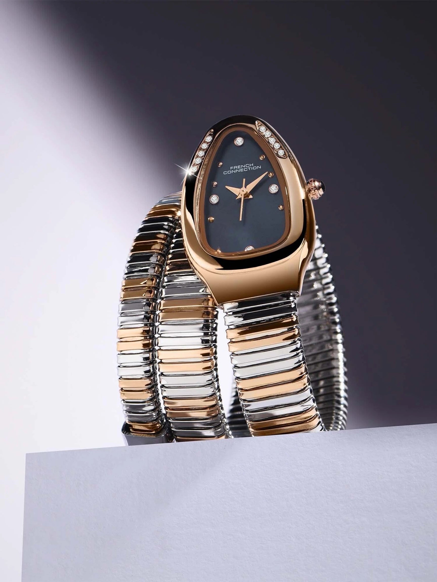 French Connection The Mystic Curve Women's Rose Gold Watch | Rhinestones Blue Sunray Dial Analog Watch – For Women FCN0110URTM